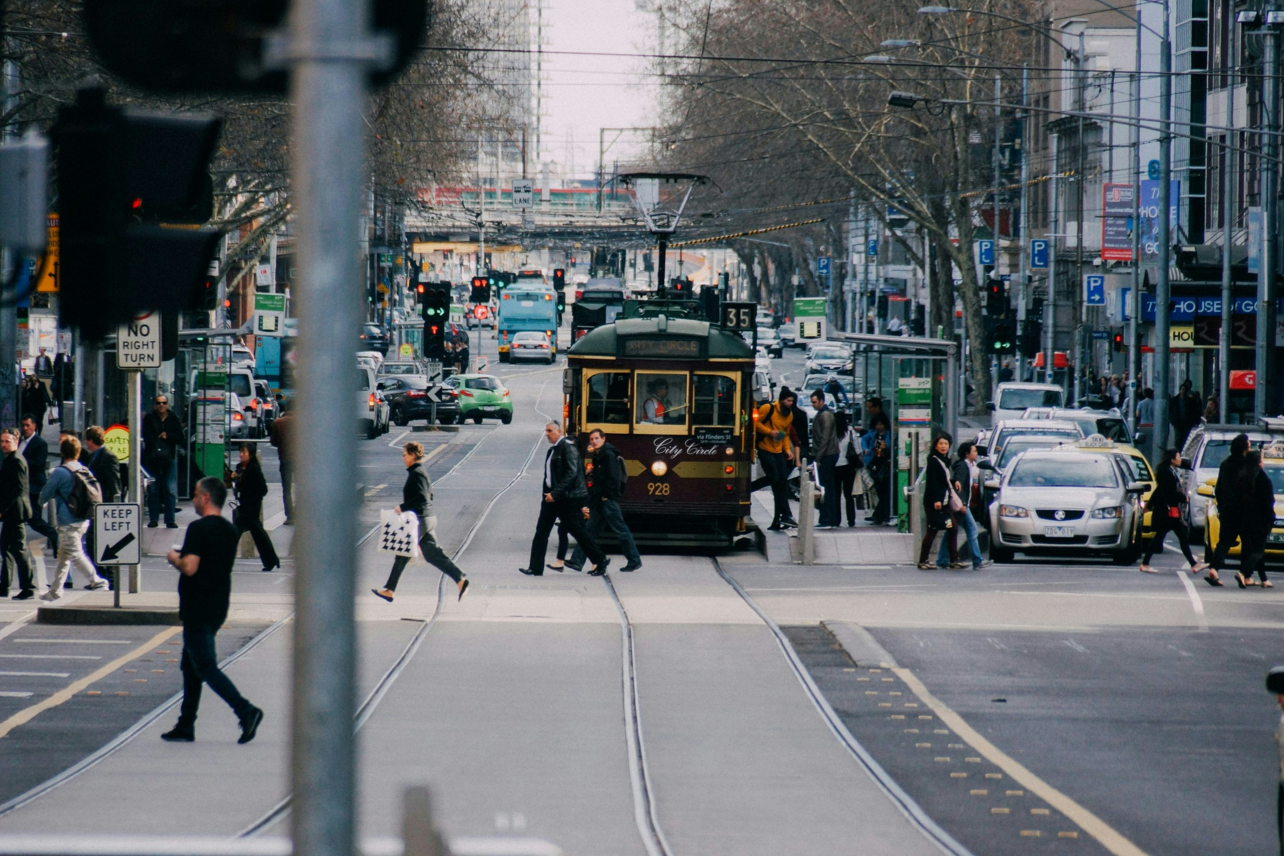 Melbourne tram traveling through a busy city street