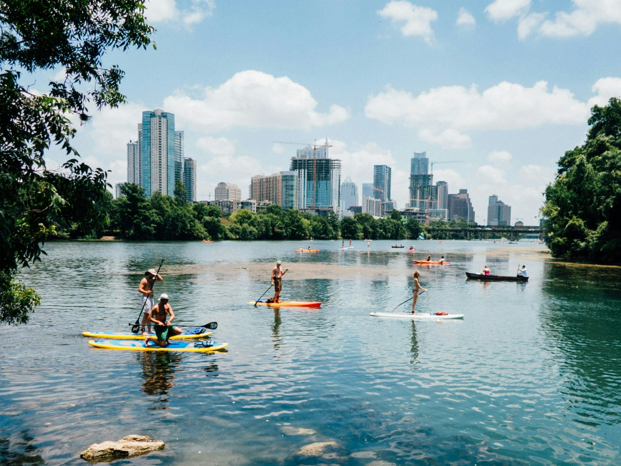 Kayakers on Lady Bird Lake with the Austin skyline in the background