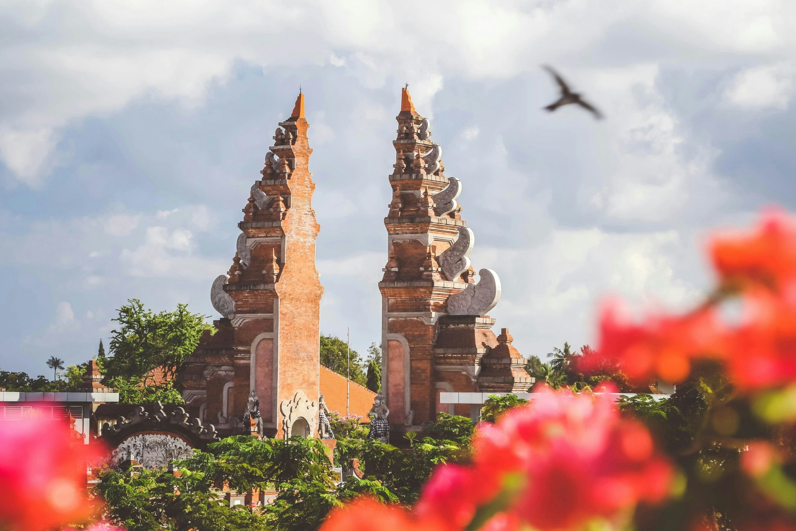 Traditional Indonesian temple surrounded by tropical greenery