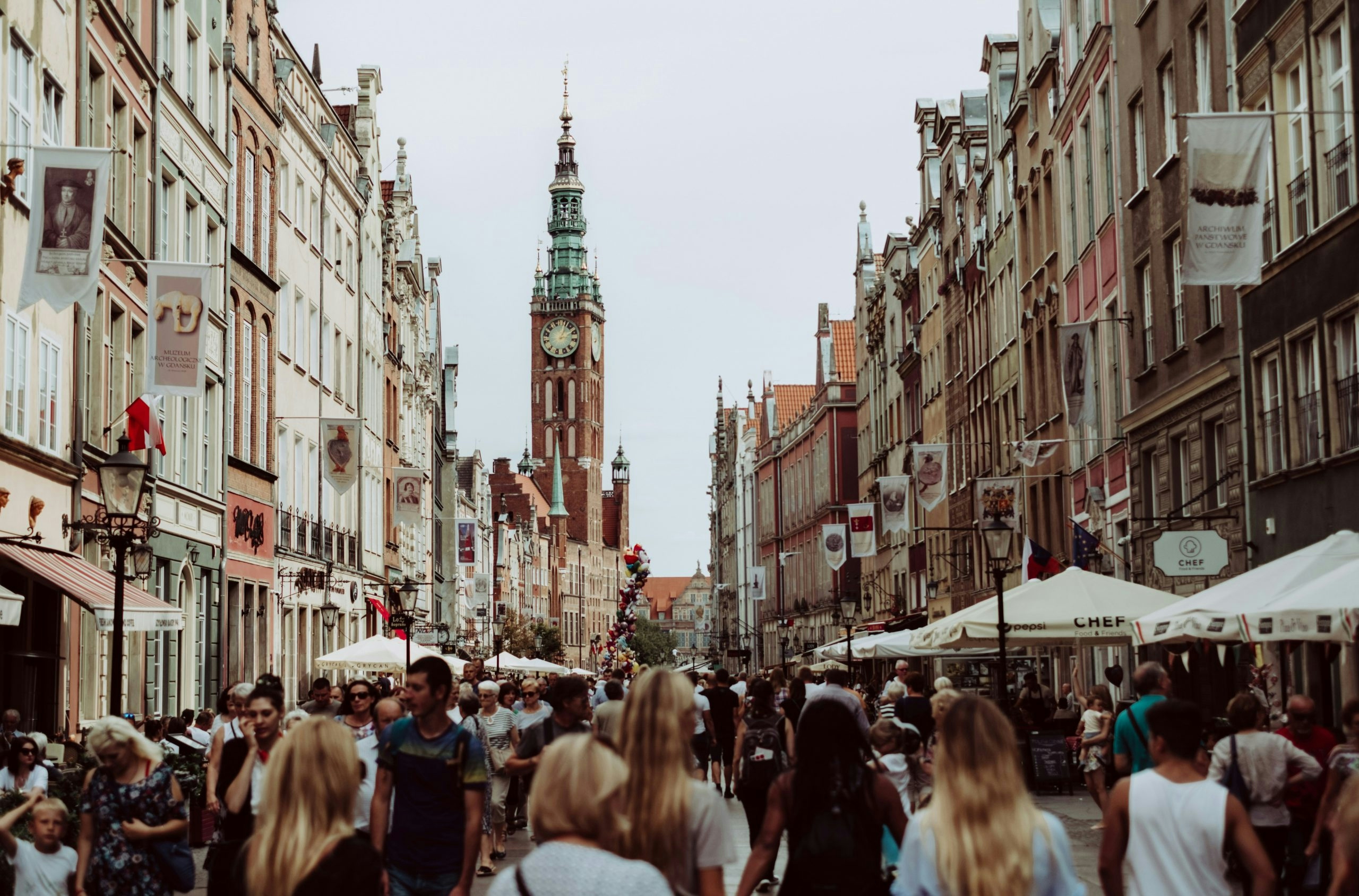 Historic European street in Poland with cafés and colorful facades