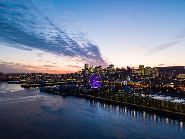 Aerial view of Montreal featuring modern skyscrapers and historic neighborhoods