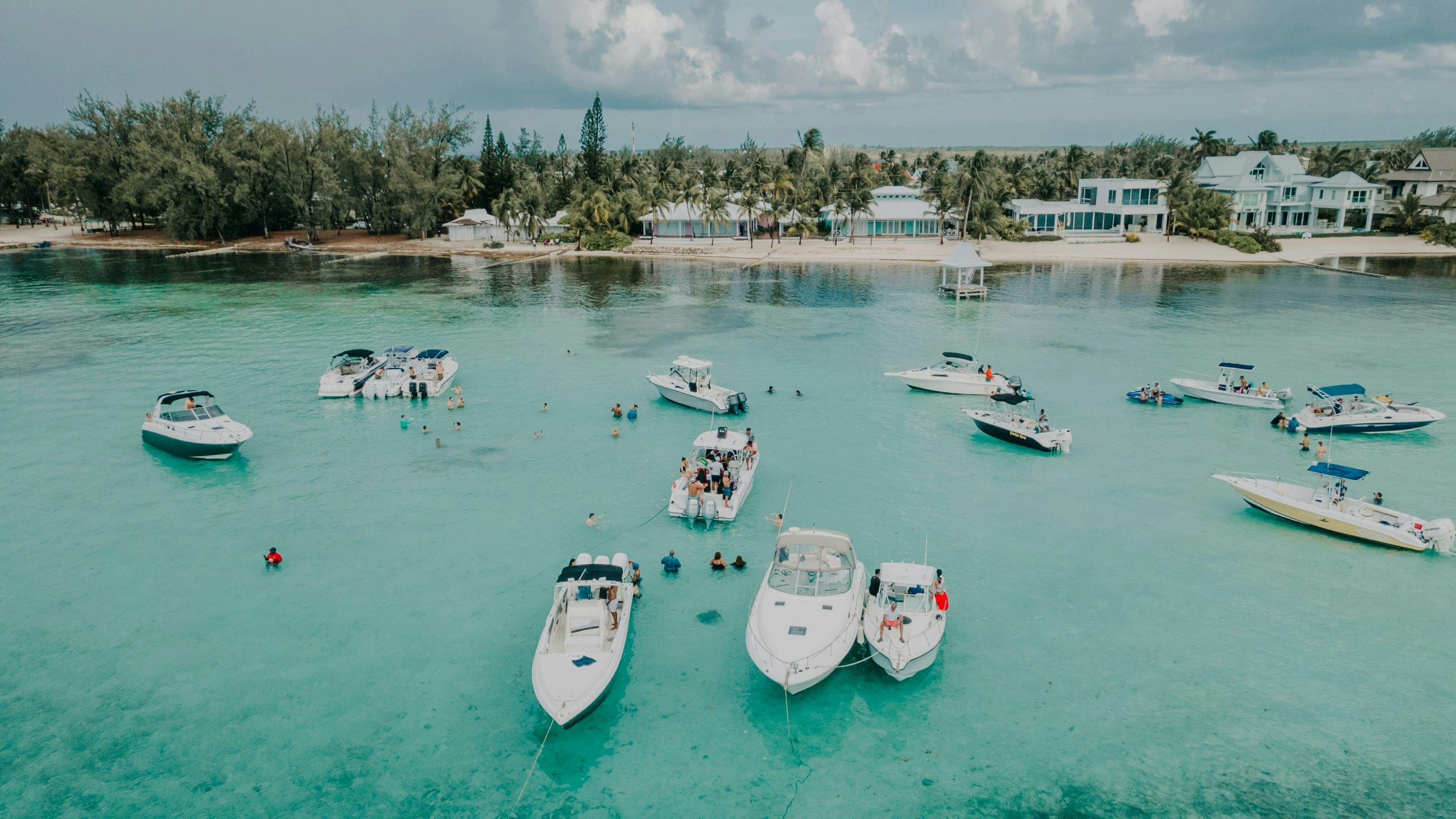boats on turquoise Caribbean waters surrounding the Cayman Islands