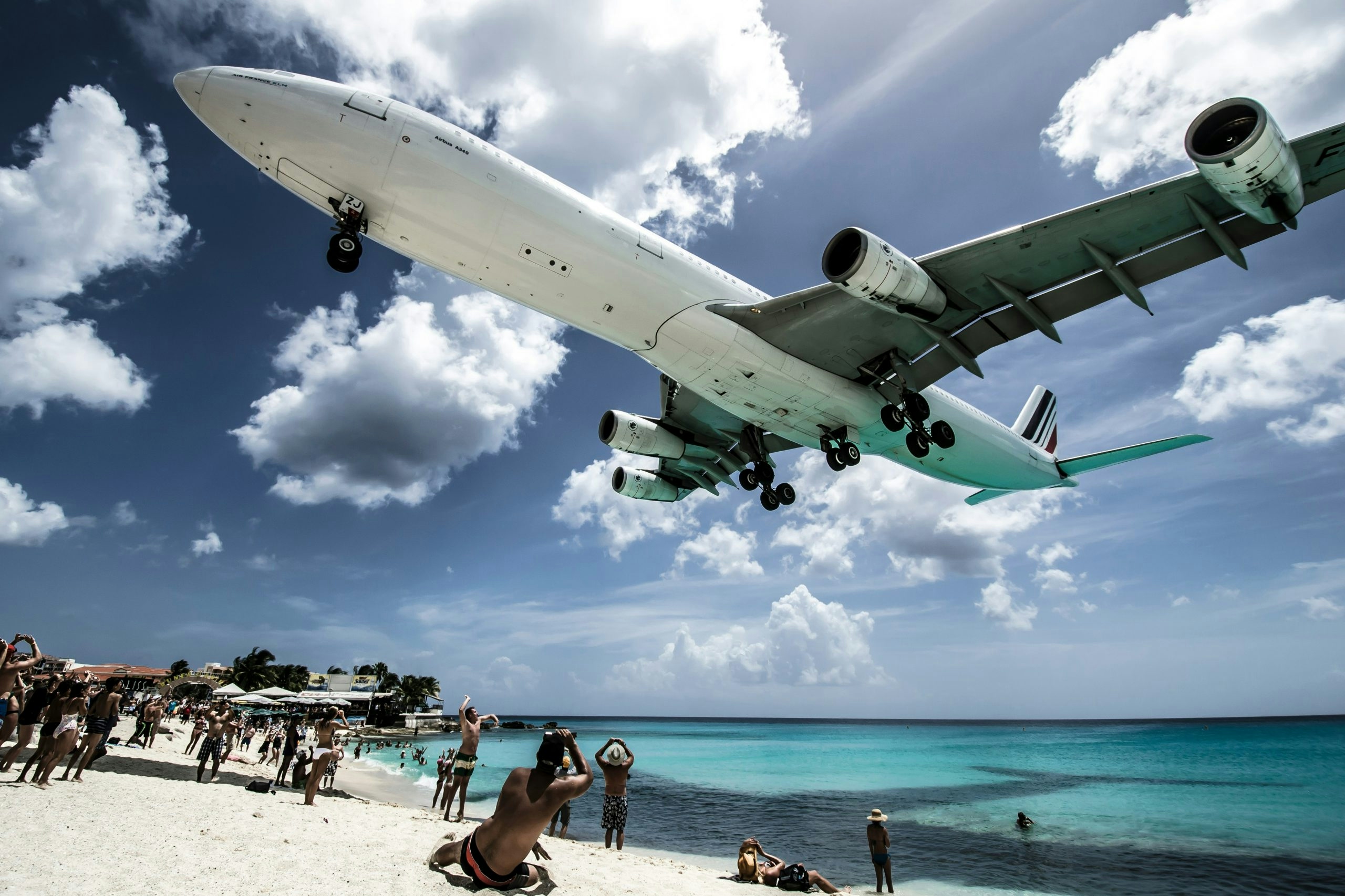 Airplane flying over a beach in St. Maarten