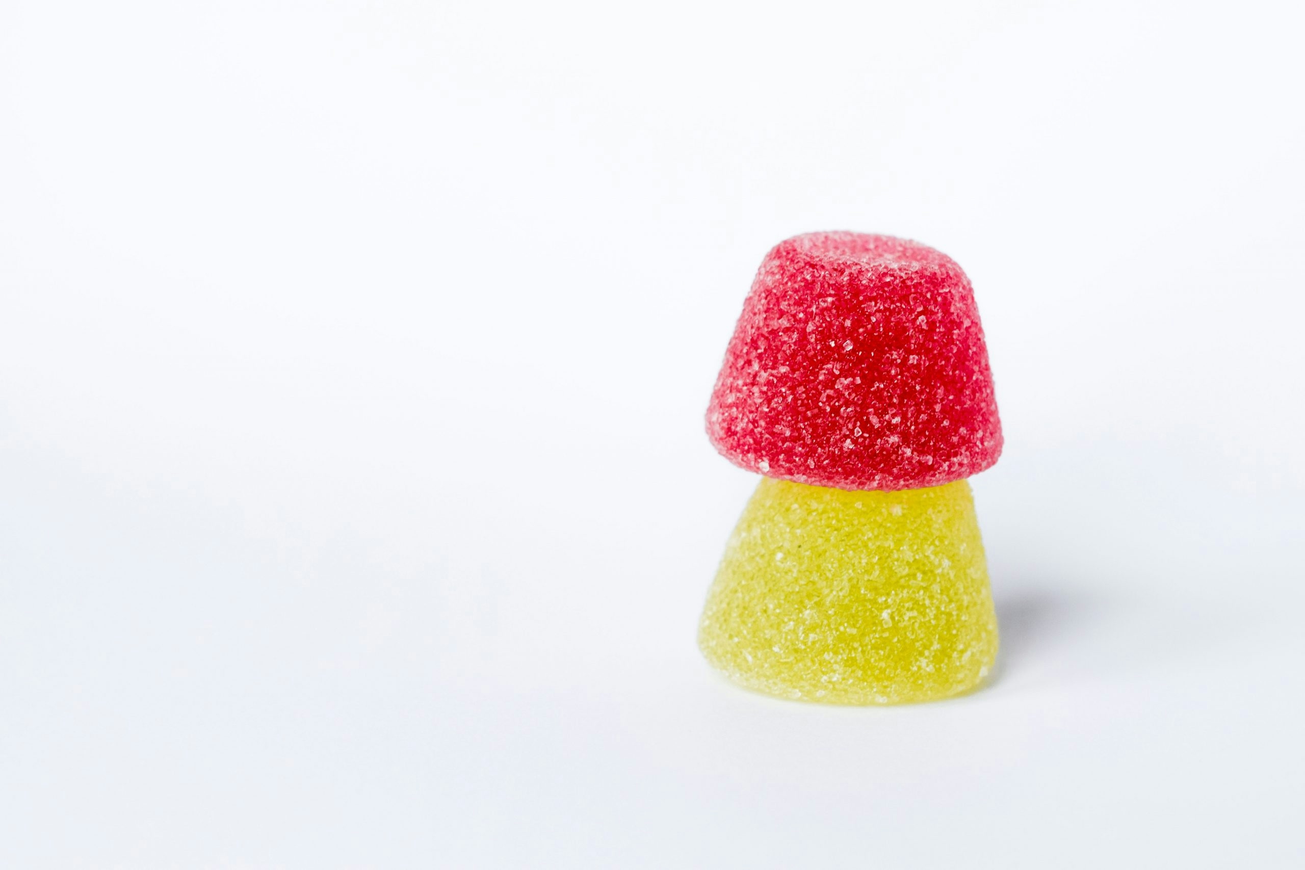 Two of the best mushroom gummies for microdosing stacked on top of each other.