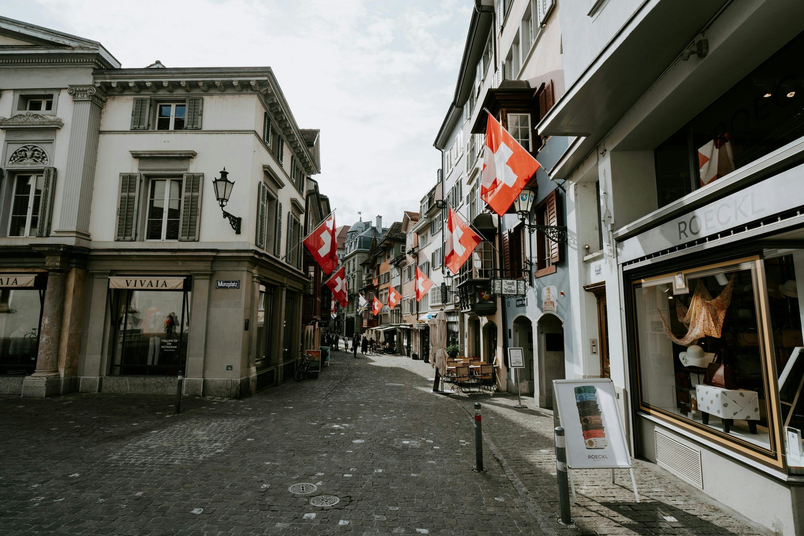 Charming historic street in Zurich lined with colorful buildings and shops