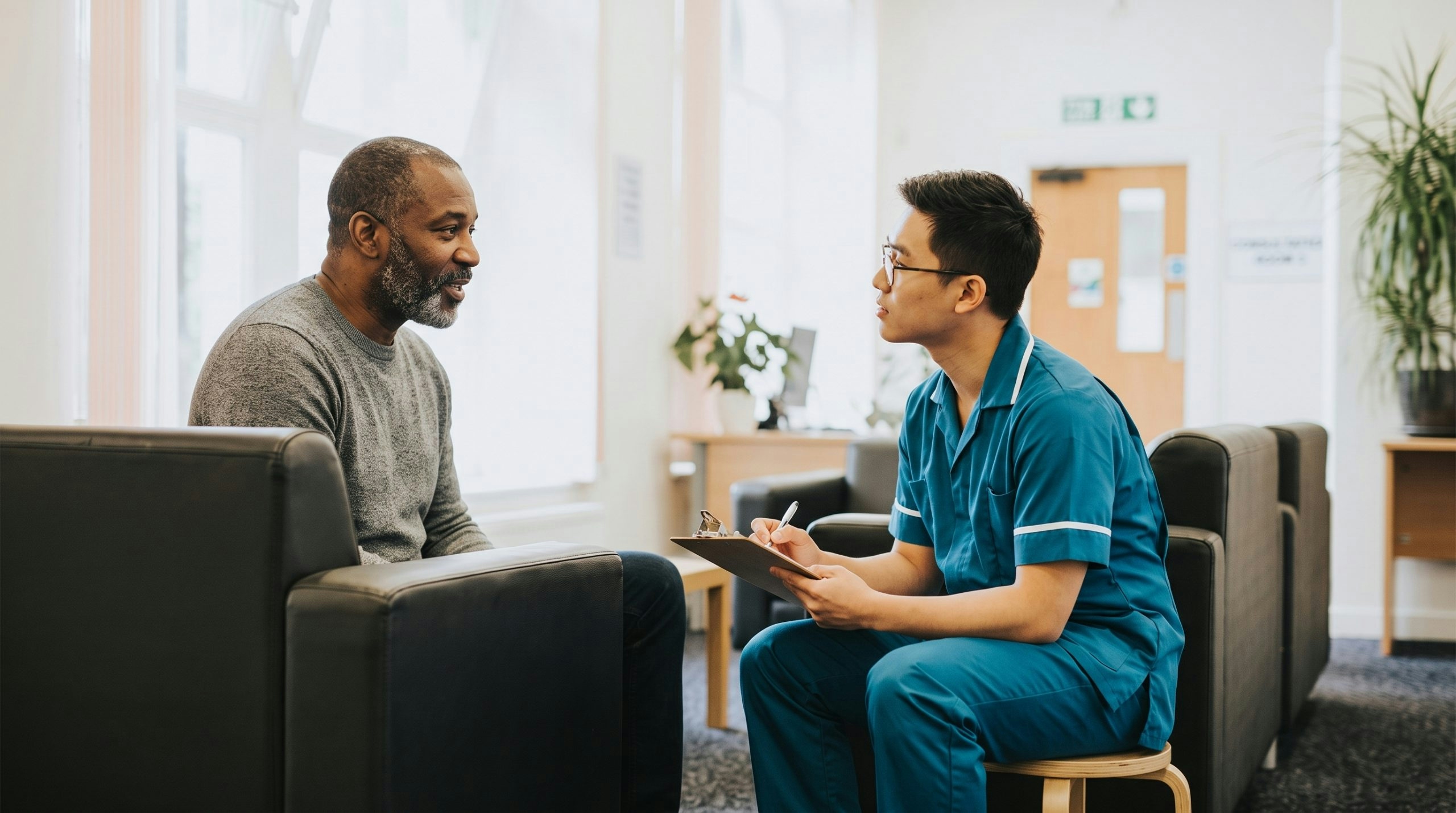 Cannabis clinic staff member assisting a patient