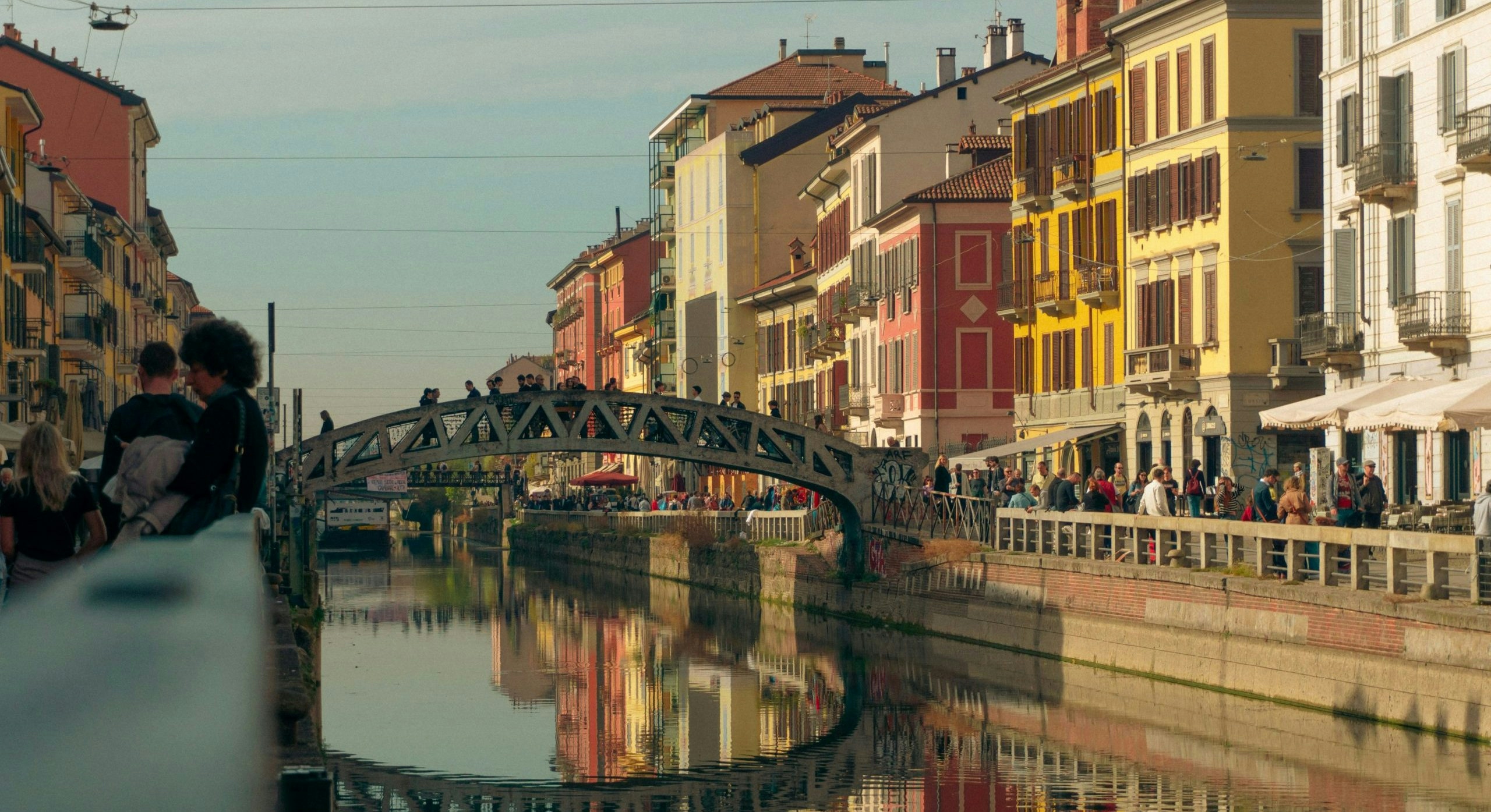 Historic canal district in Milan with colorful buildings and waterfront views.