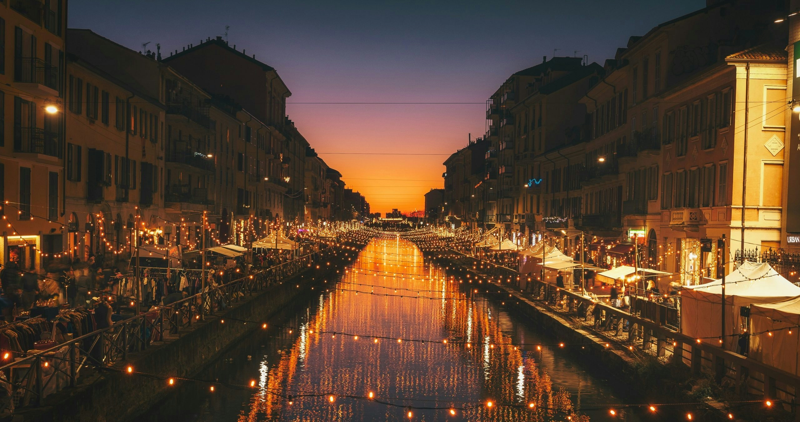 Waterway surrounded by historic architecture in Milan