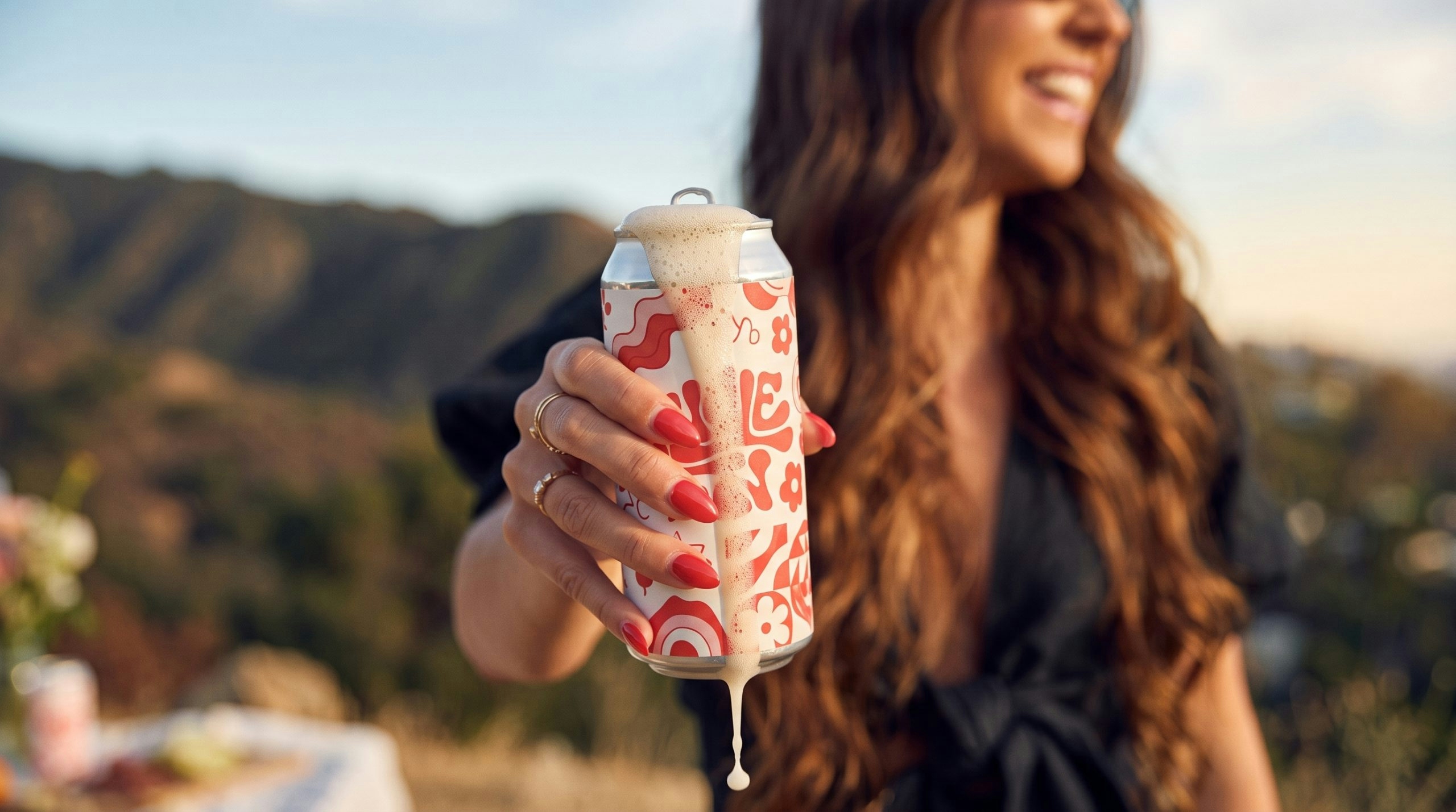 woman holding an open can of seltzer