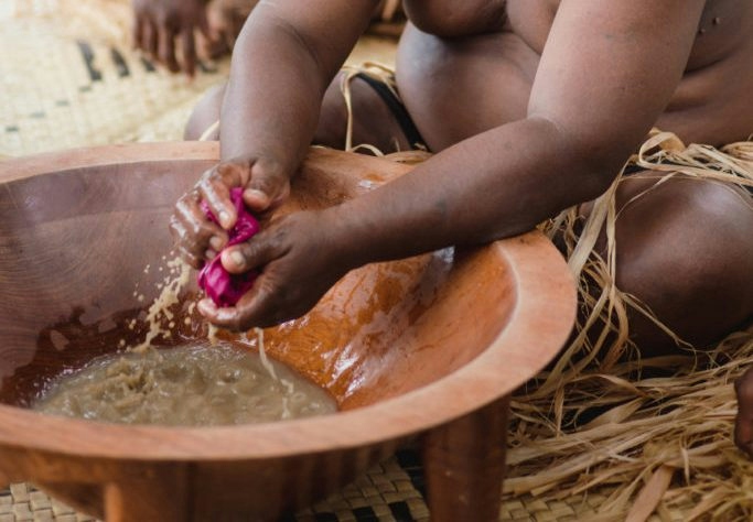 man doing the traditional preparation of kava