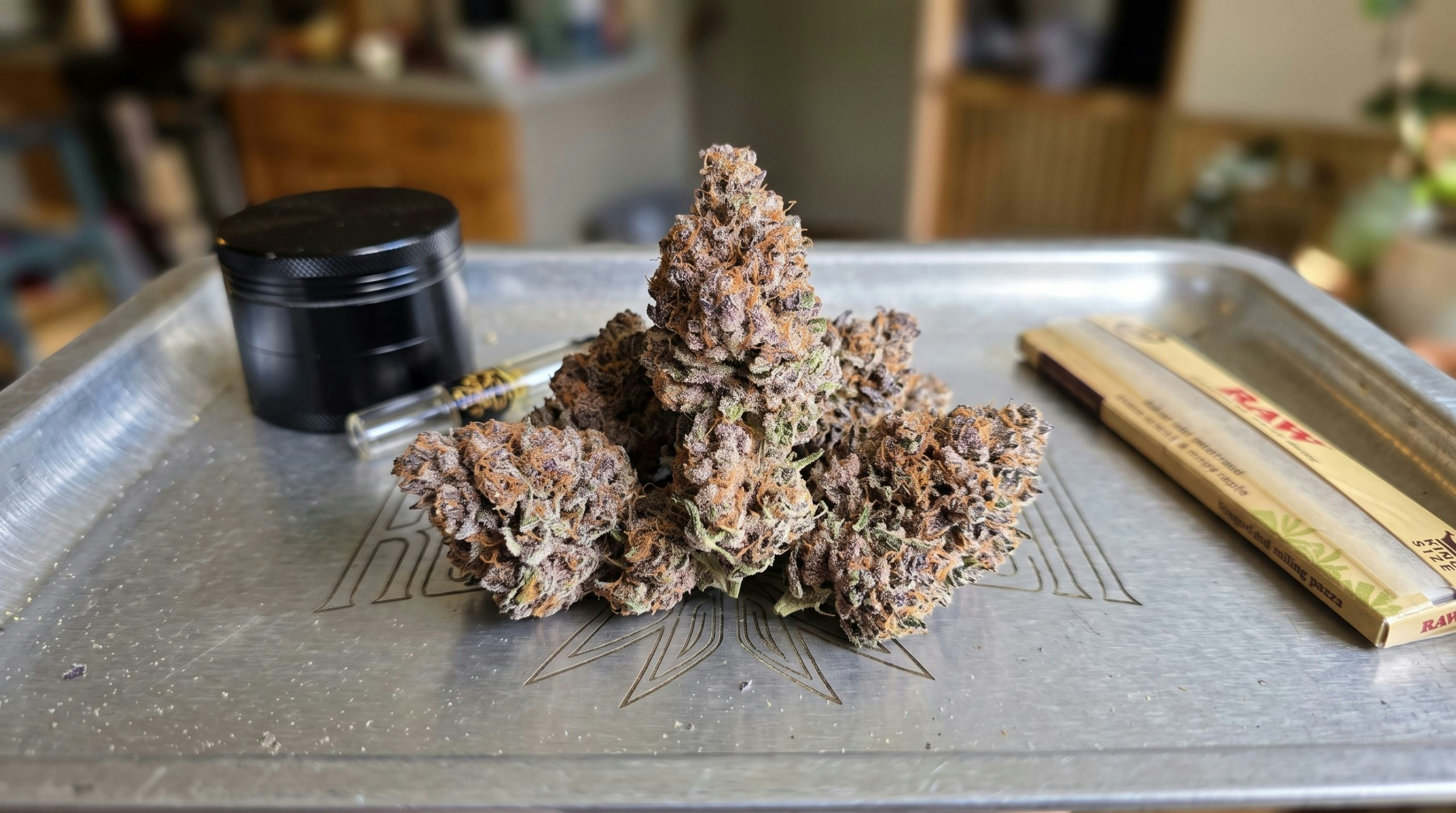Multiple cannabis flower buds displayed on a rolling tray