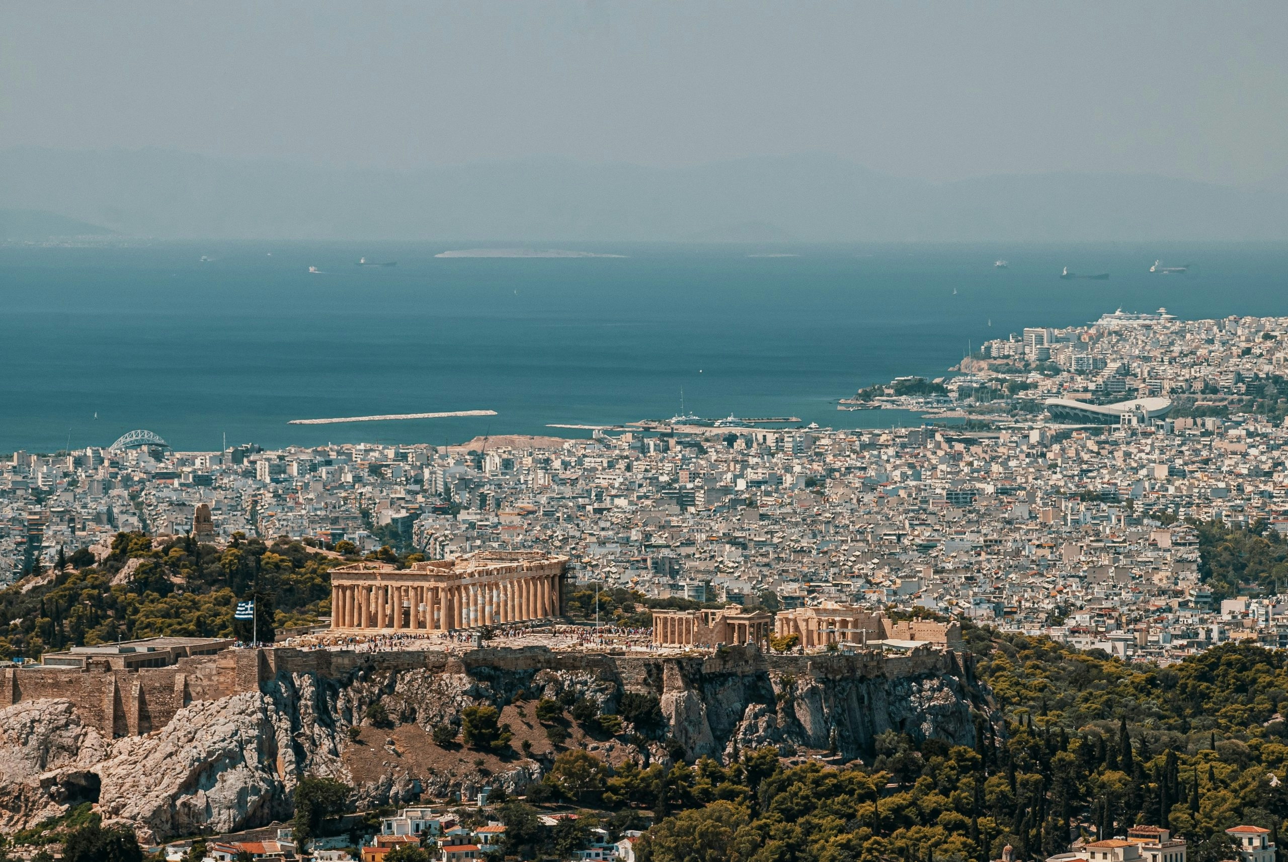Panoramic Athens city view with historic landmarks and the Acropolis dominating the skyline