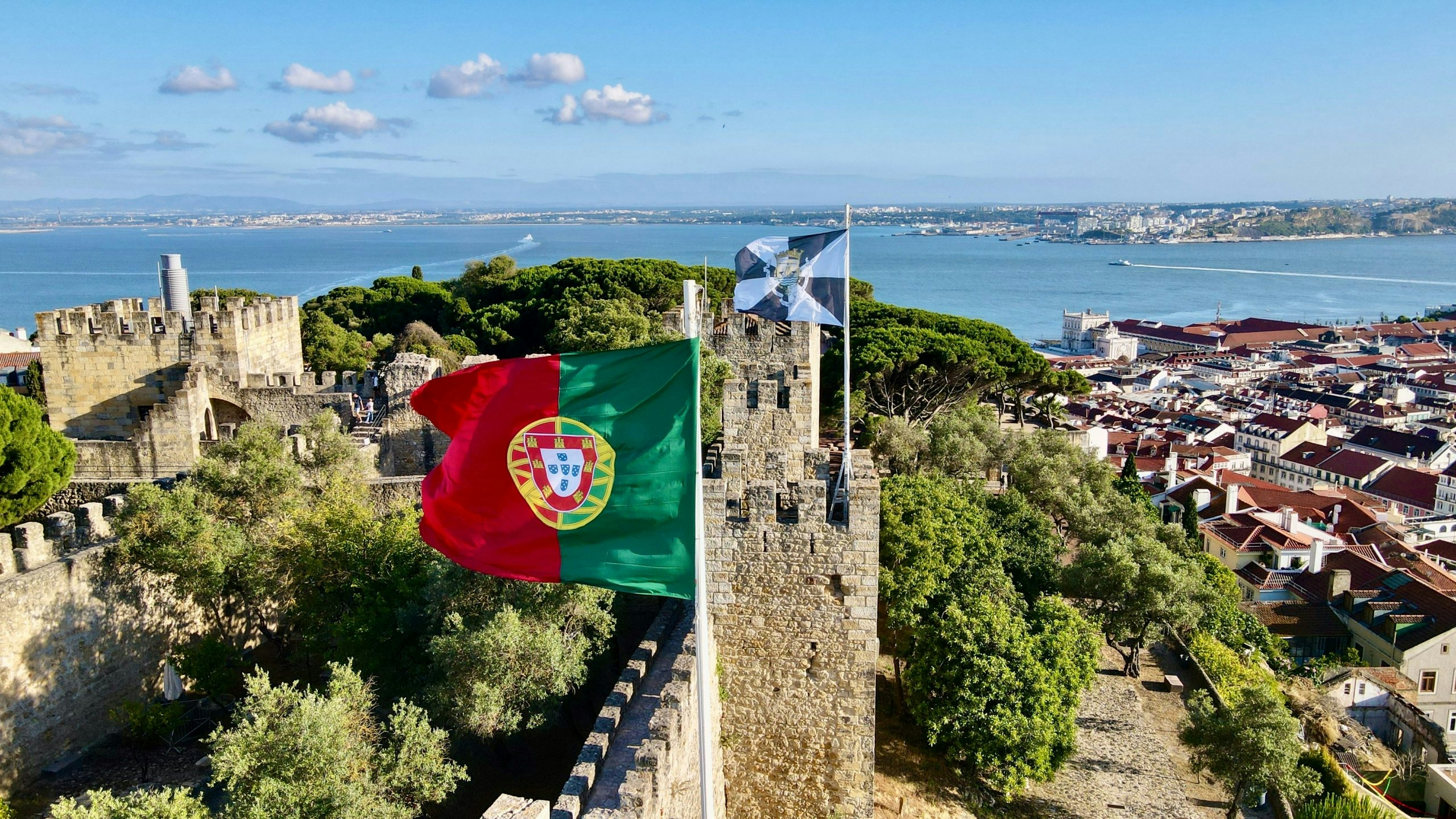 Portuguese flag waving against a clear sky