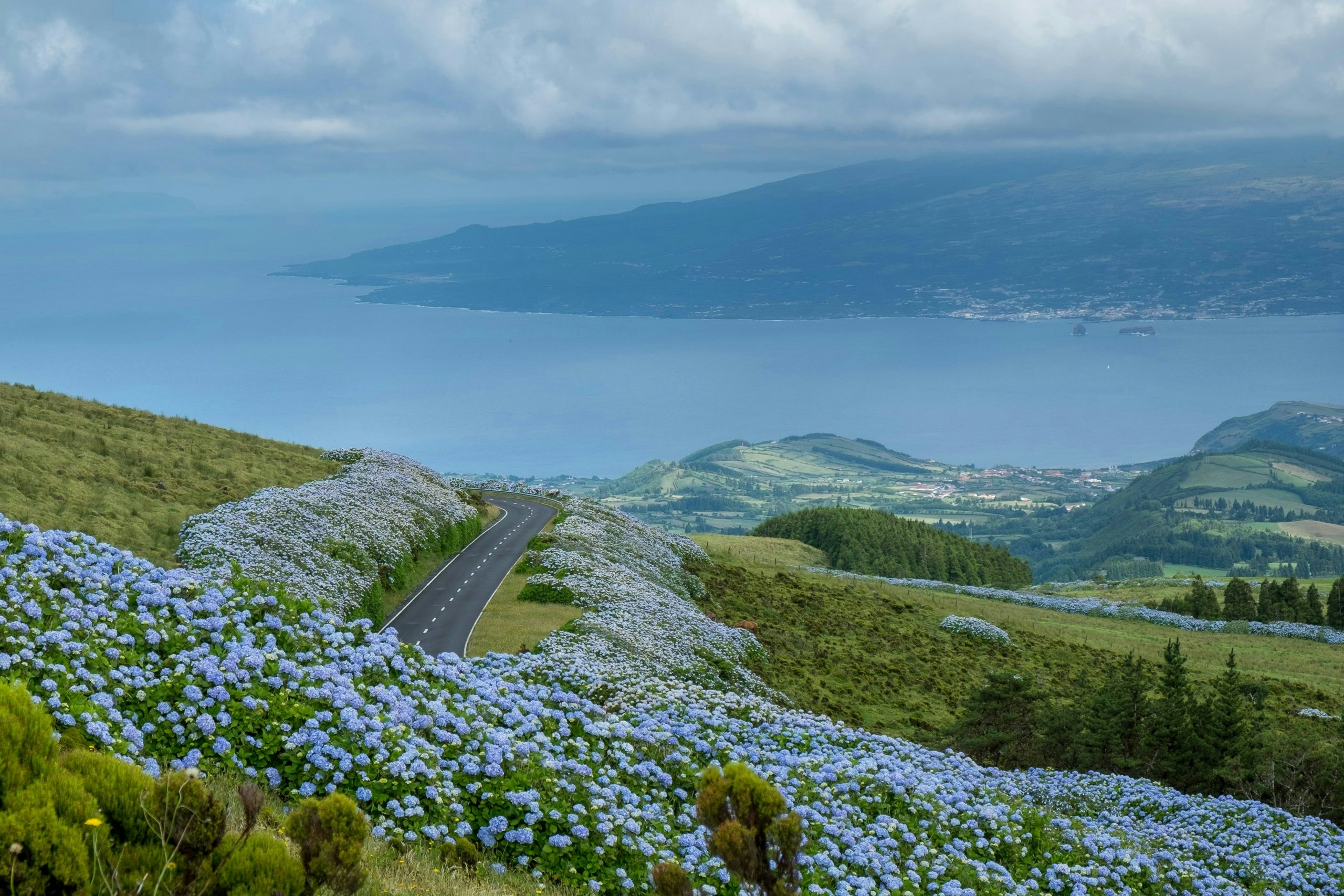 Picturesque Azores coastline surrounded by green cliffs and deep blue waters