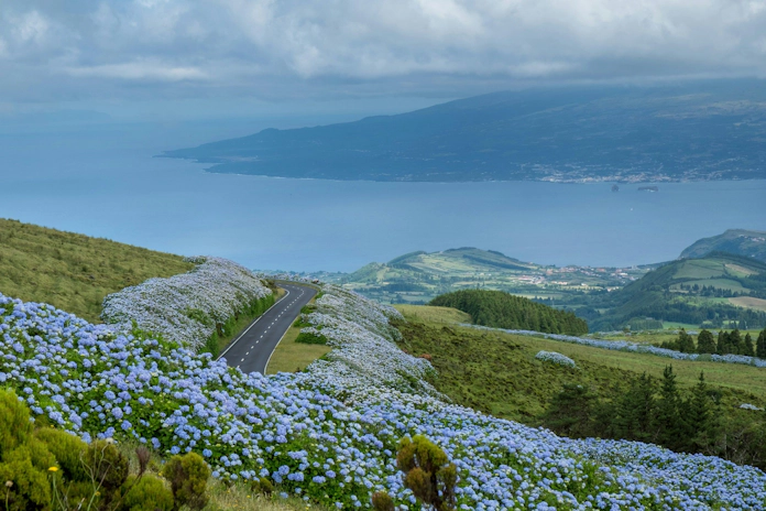 Picturesque Azores coastline surrounded by green cliffs and deep blue waters