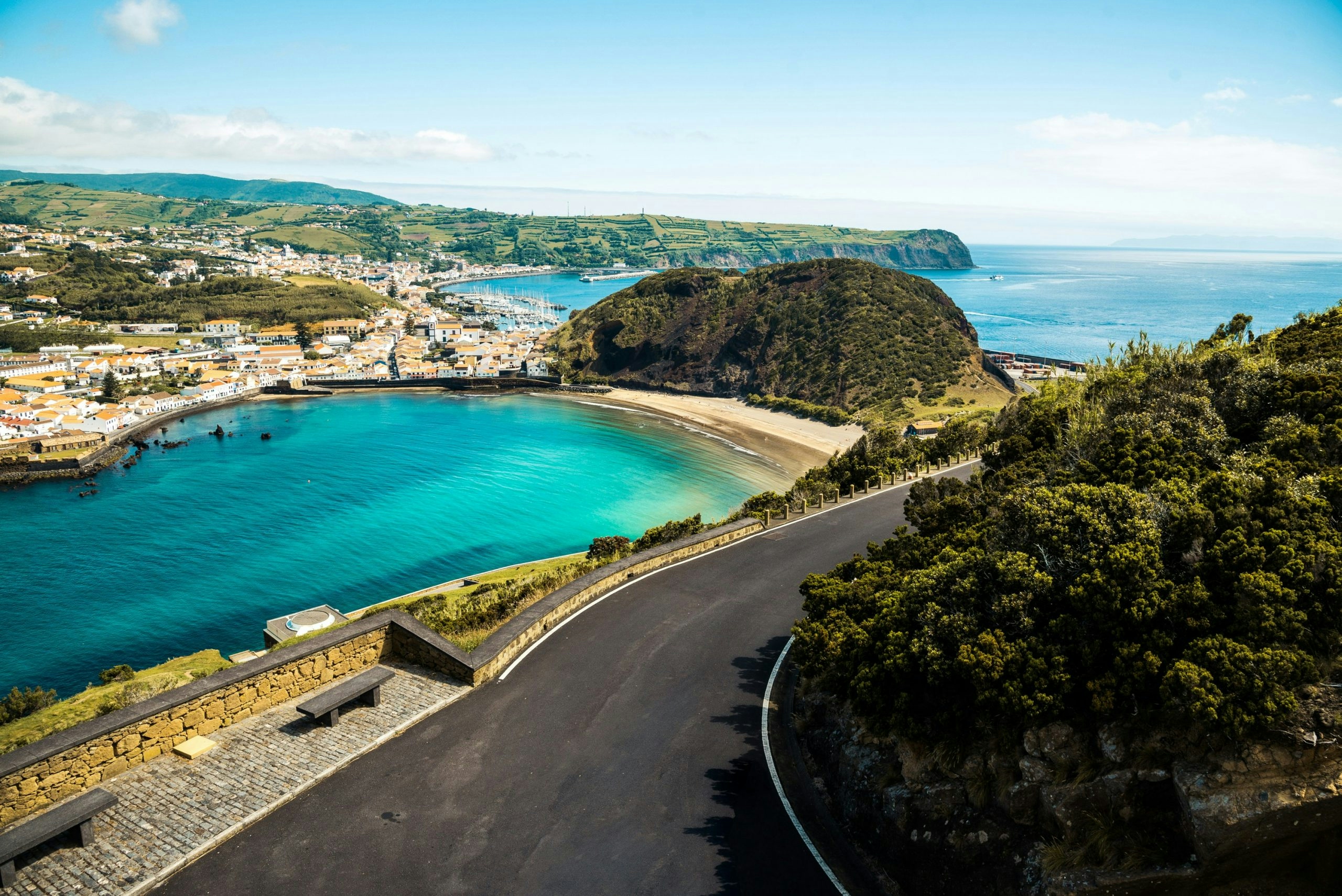 Rolling green hills and volcanic scenery across the Azores islands