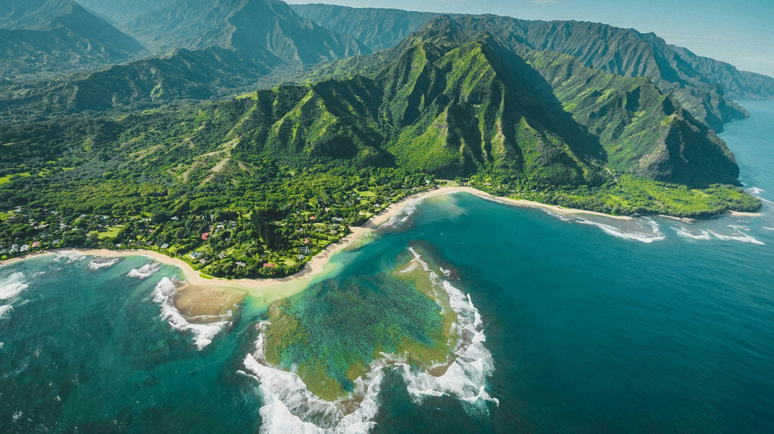 Scenic landscape of Kauai, Hawaii, with lush mountains and tropical greenery