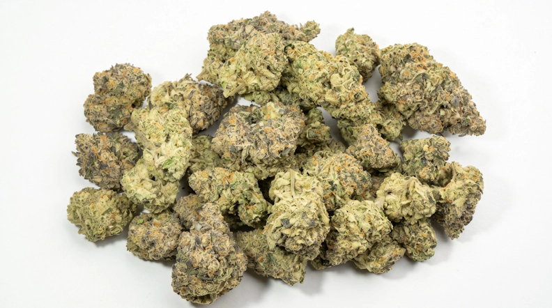 cannabis buds over a white background