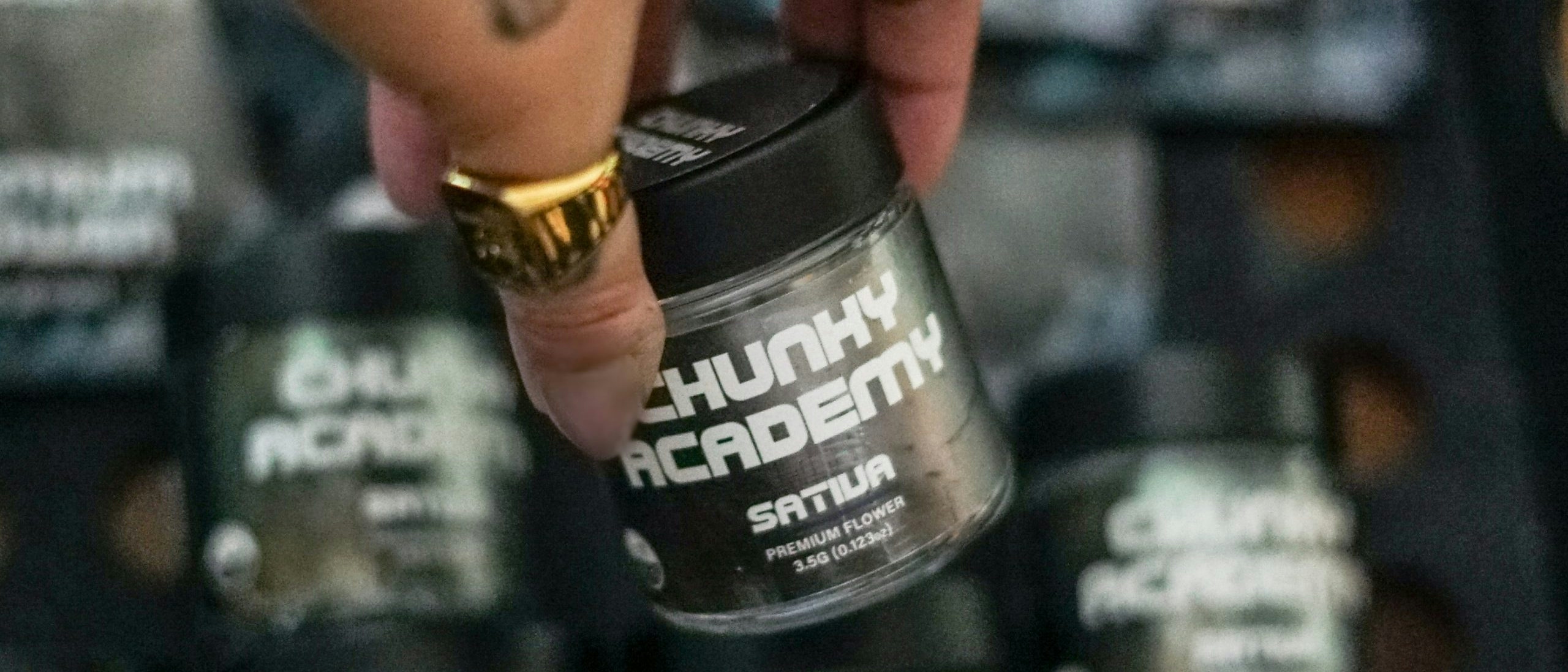 hand holding a chunky academy jar